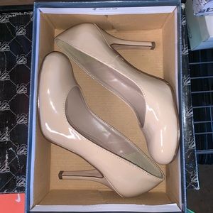 Nude round tip heels.